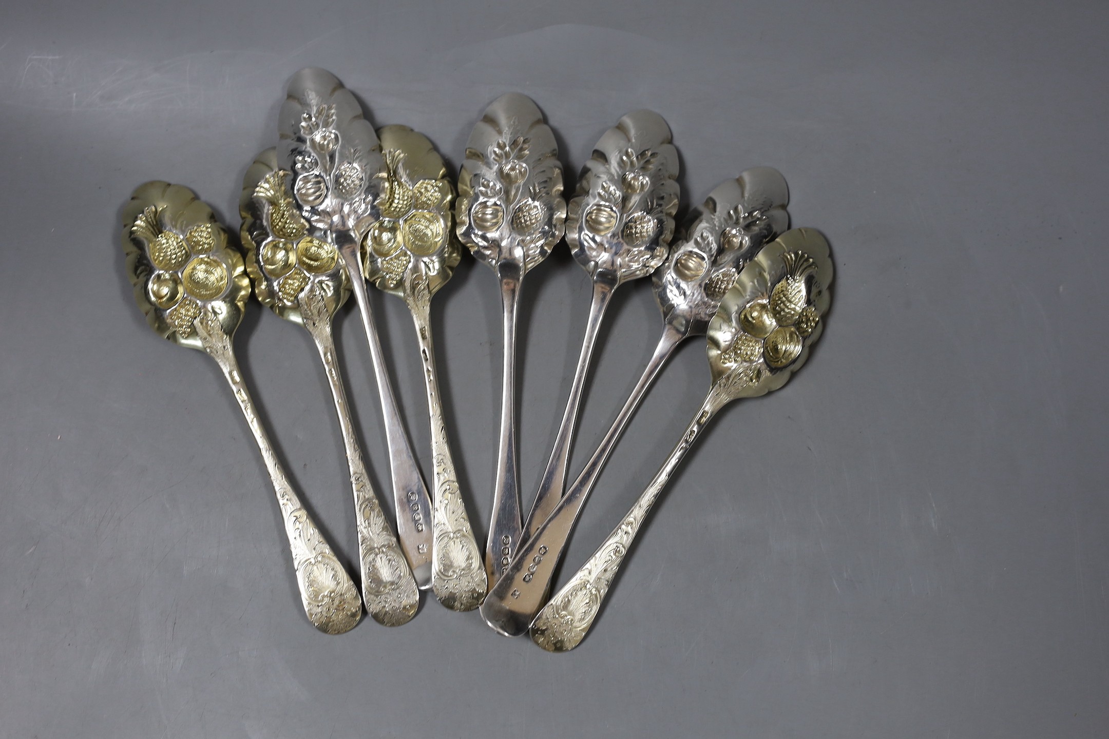 A set of four George III silver 'berry' spoons, by Eley & Fearn, London, 1805 and four earlier silver 'berry' spoons, marks pinched